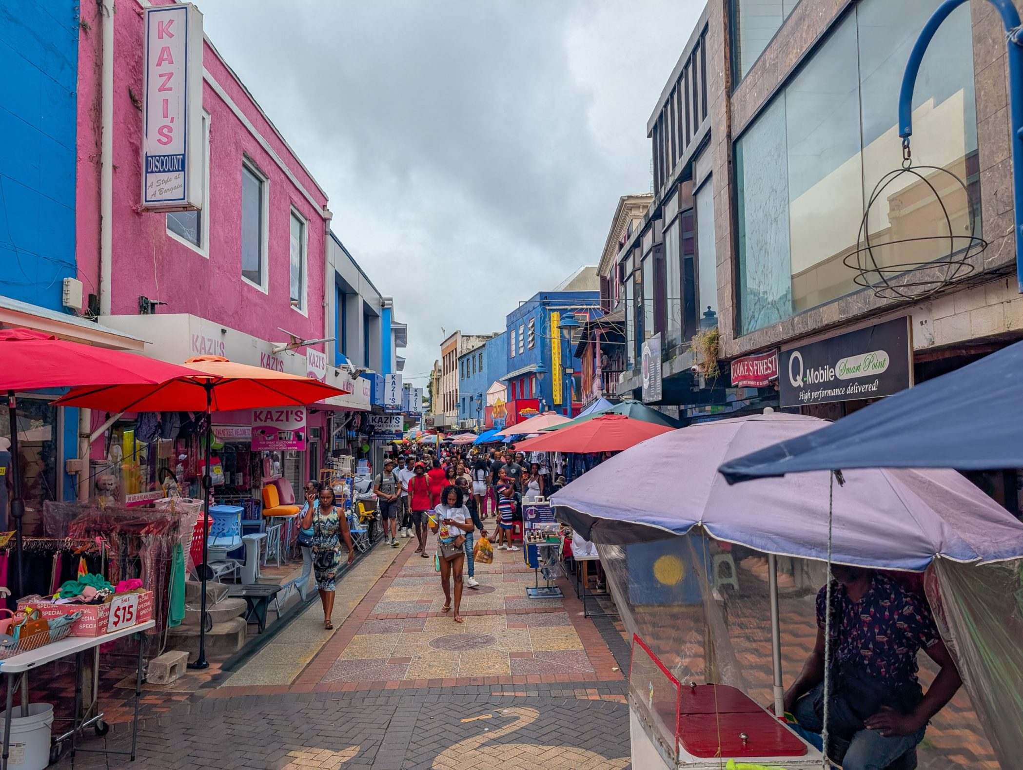 Pedestrian street with colorful market stalls